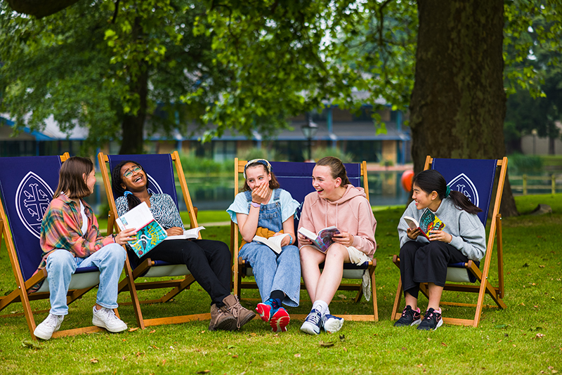 Wycombe Abbey girls sat on deckchairs
