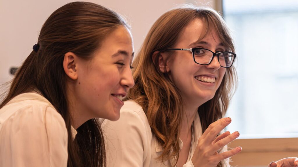 Two girls laughing.