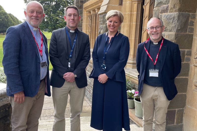 Reverend Canon Chris Bull. Padre Paul Stanaway, Jo Duncan and Reverend Charlie Kerr stood outside Chapel.