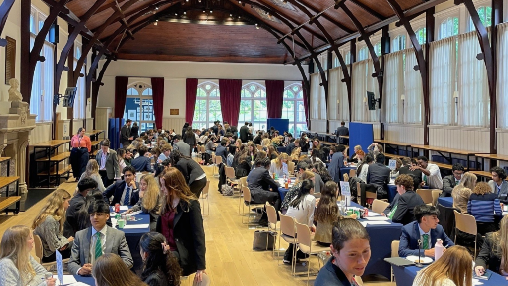 Pupils sat at tables in Big School.