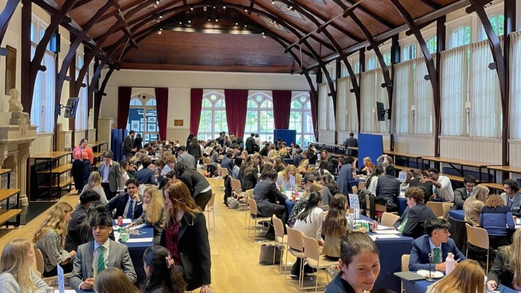 Pupils sat at tables in Big School.