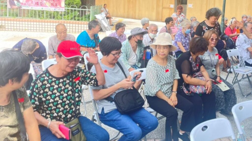 Elderly people sat waiting for Gloria to present.