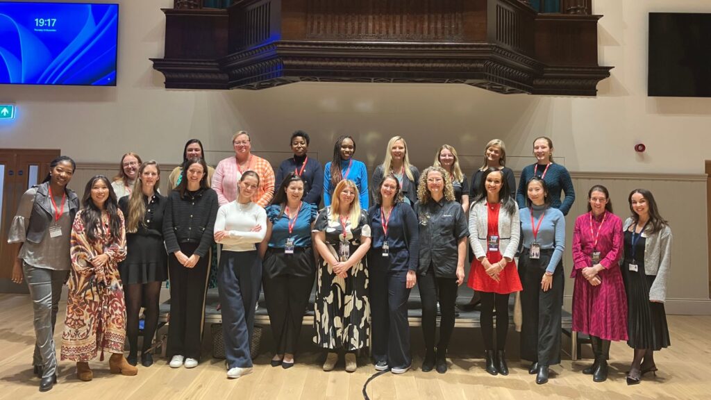 All Wycombe Abbey speakers stood together and smiling.