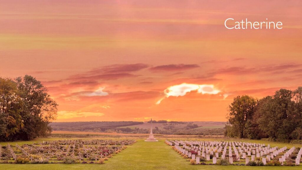 Catherine's photo which showsa read sky and rolling hills behind a cemetery.