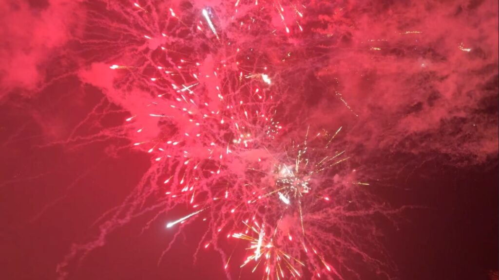 Red and gold fireworks lighting up the night sky.