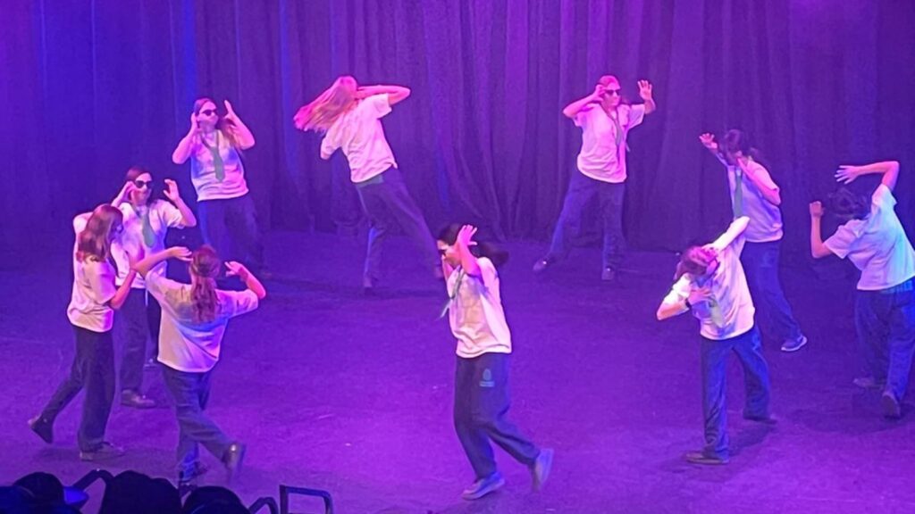 Ten Wycombe Abbey pupils dancing in  a circle.