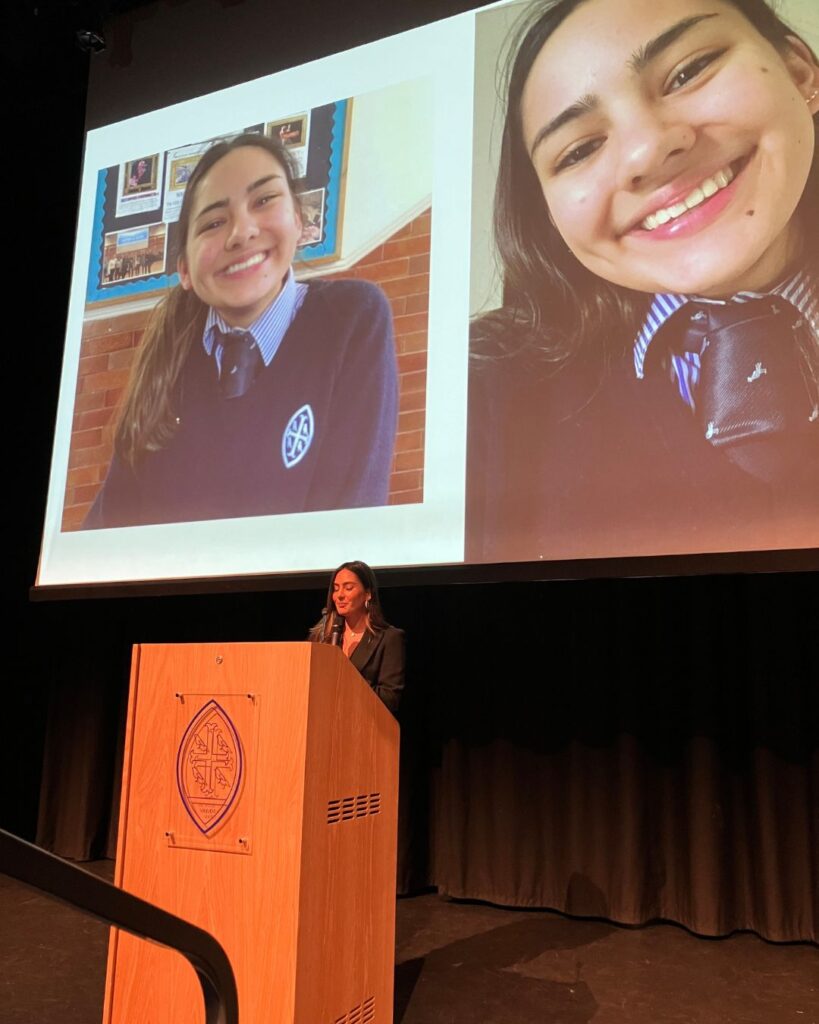 Lissie Mackintosh presenting in front of two pictures of herself as a Wycombe Abbey pupil.