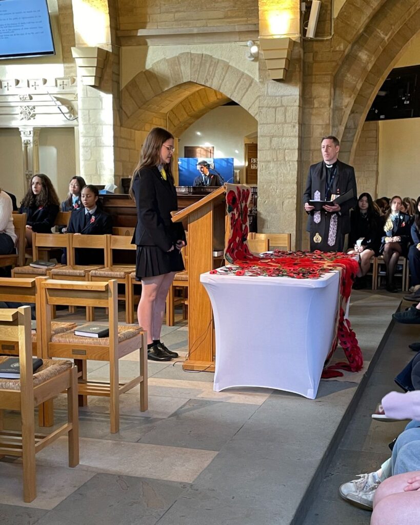 Pupil giving a reading.