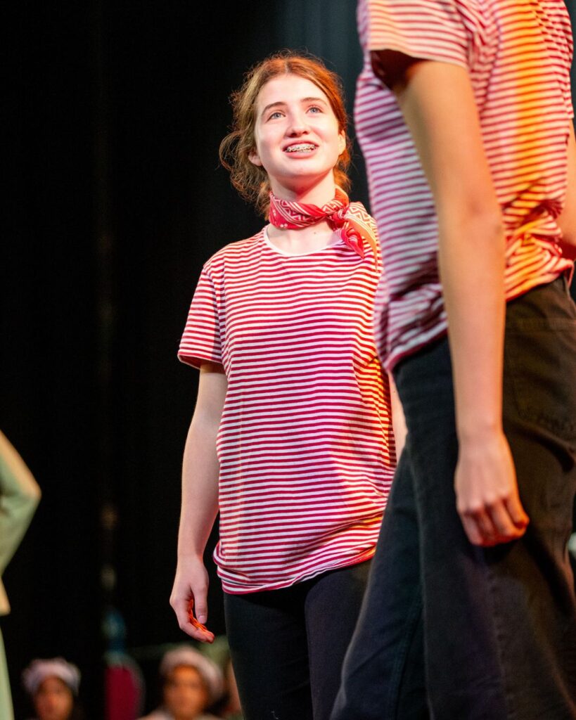 A Wycombe Abbey pupil siling whilst dressed as a sailor.