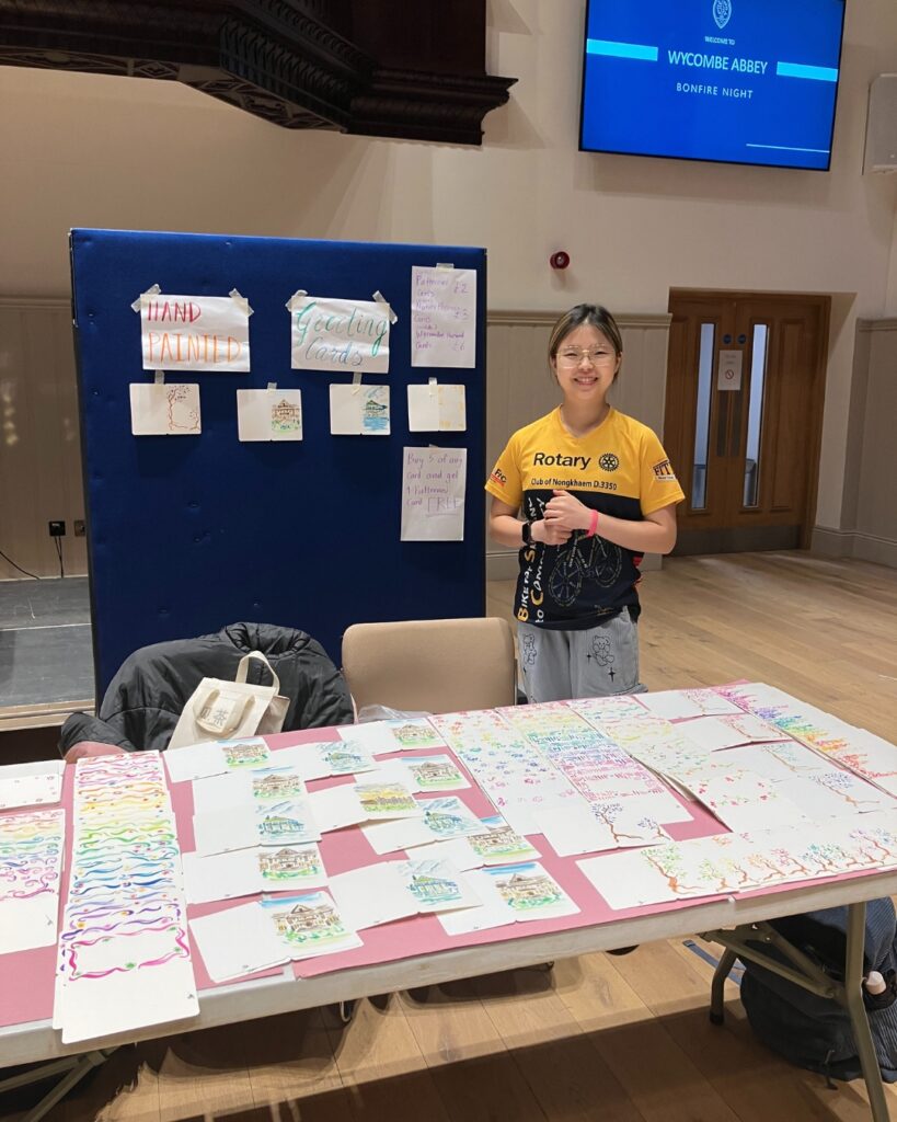 A pupil selling handmade cards.