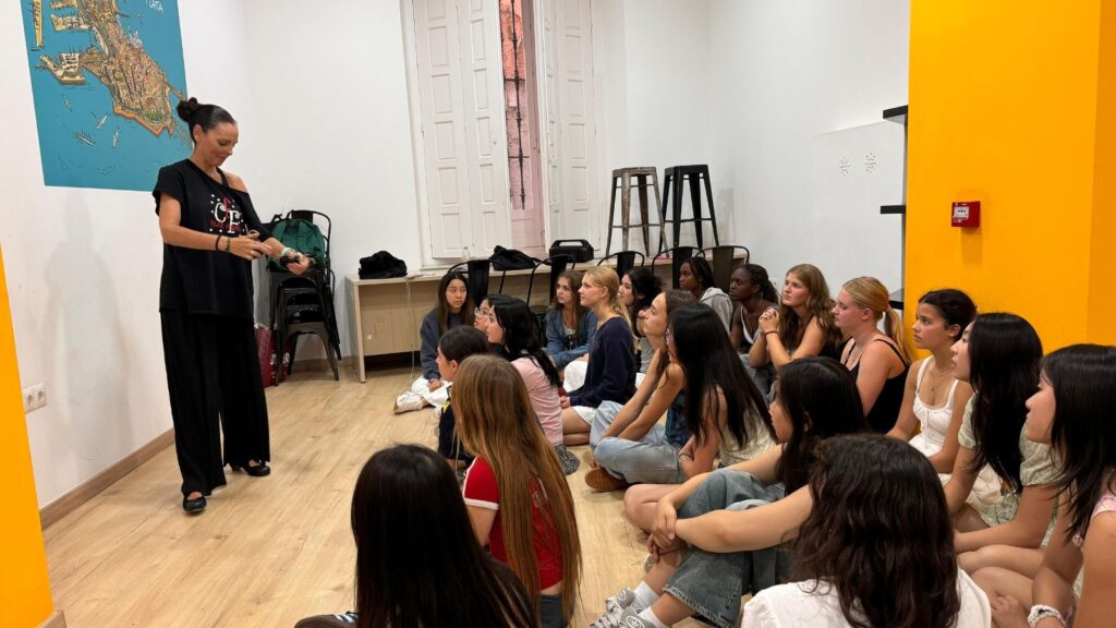 Pupils sat listening to a Spanish teacher.
