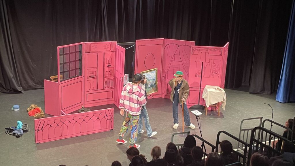 Pupils on stage with Onatti theatre troupe.