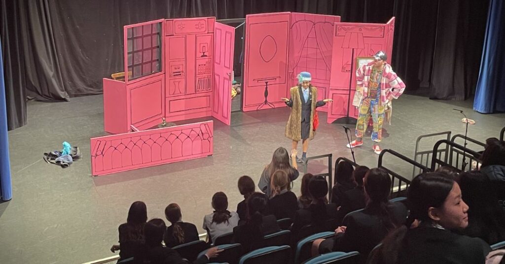 Pupil on stage with Onatti theatre troupe.