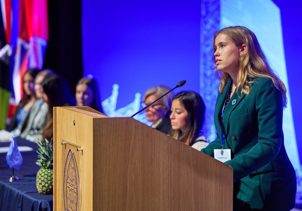 Ava stood behind a Wycombe Abbey lectern.