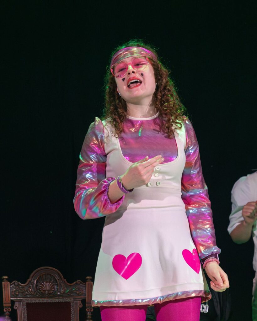A girl in a Queen of Hearts costume