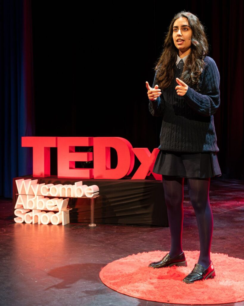 Neda talking passionately.