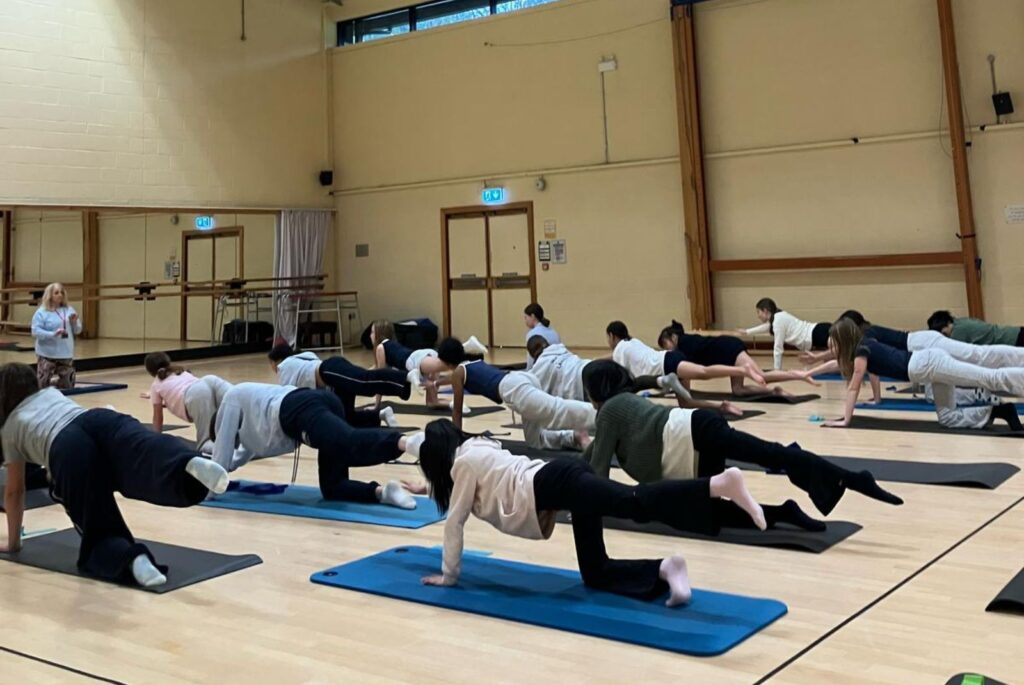 Girls doing pilates.