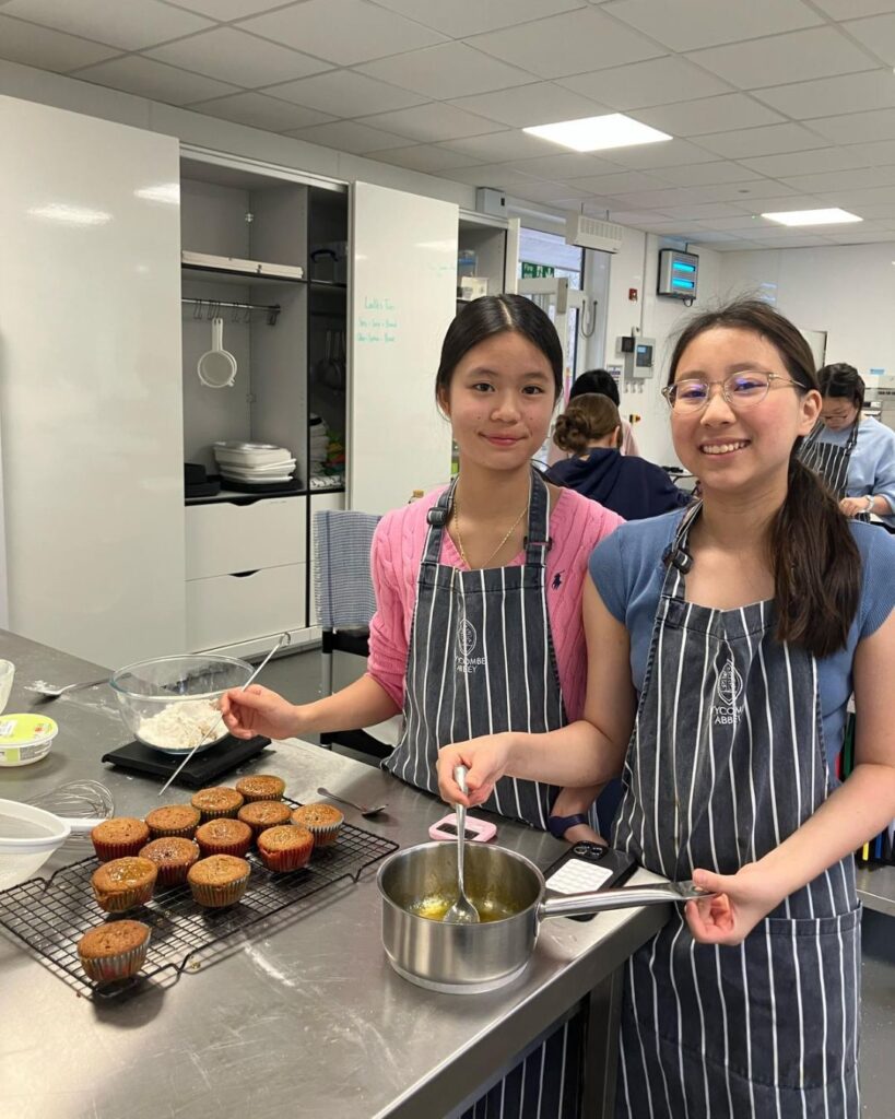 Girls making carrot cake.