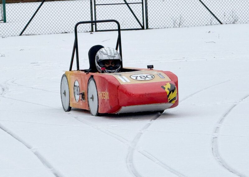 Wycombe Abbey's Greenpower car 'Phoenix' driving through the snow.