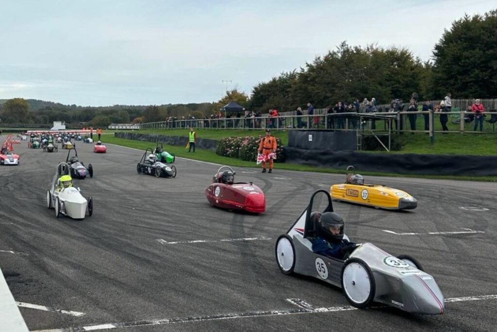 Cars racing on the Goodwood circuit
