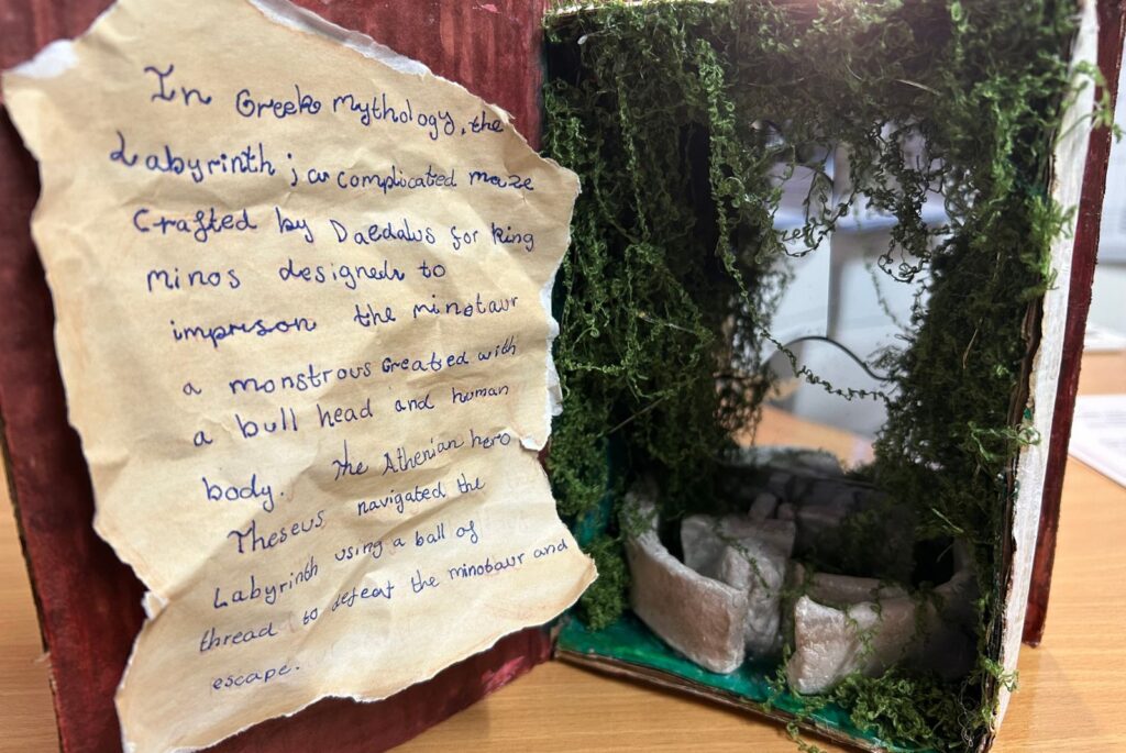 A poem next to a model of Daedalus’ Labyrinth.