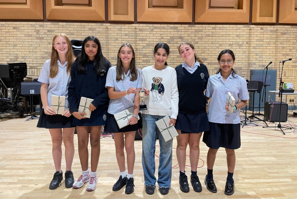 Finalists stood together, each holding their prize.