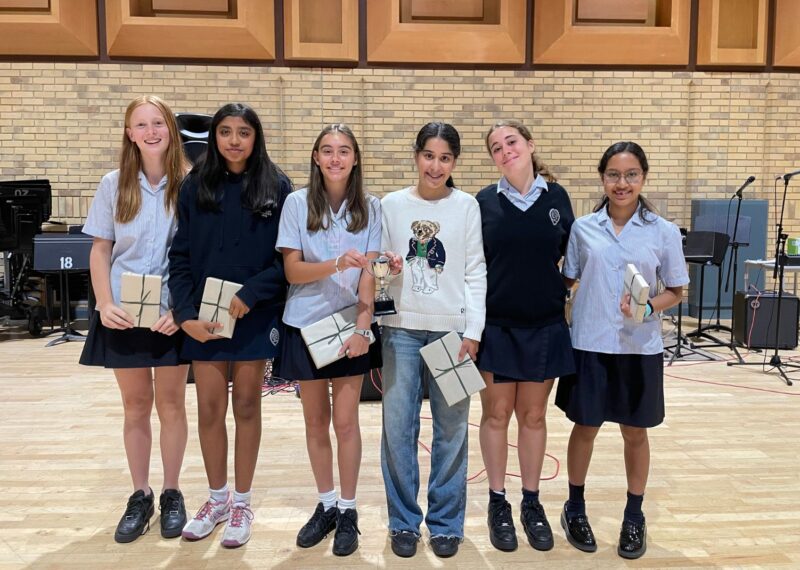 Finalists stood together, each holding their prize.