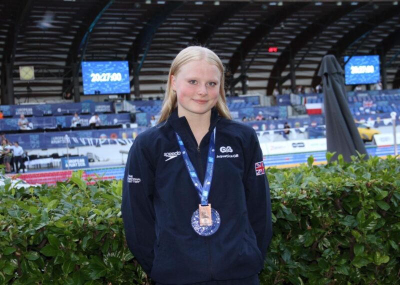 Annabelle smiling with her bronze medal at the European Junior Swimming Championships.