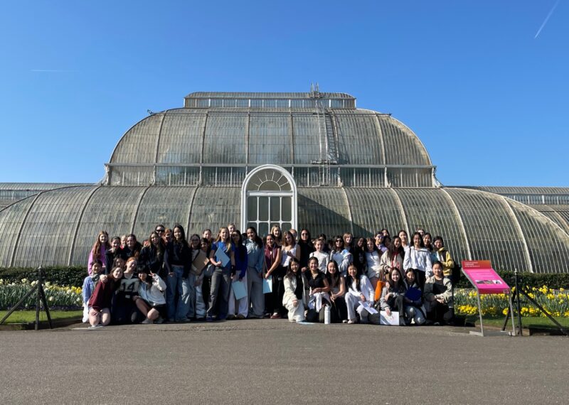 Group of Girls standing in front of the observatory glass domed building at Kew Gardens